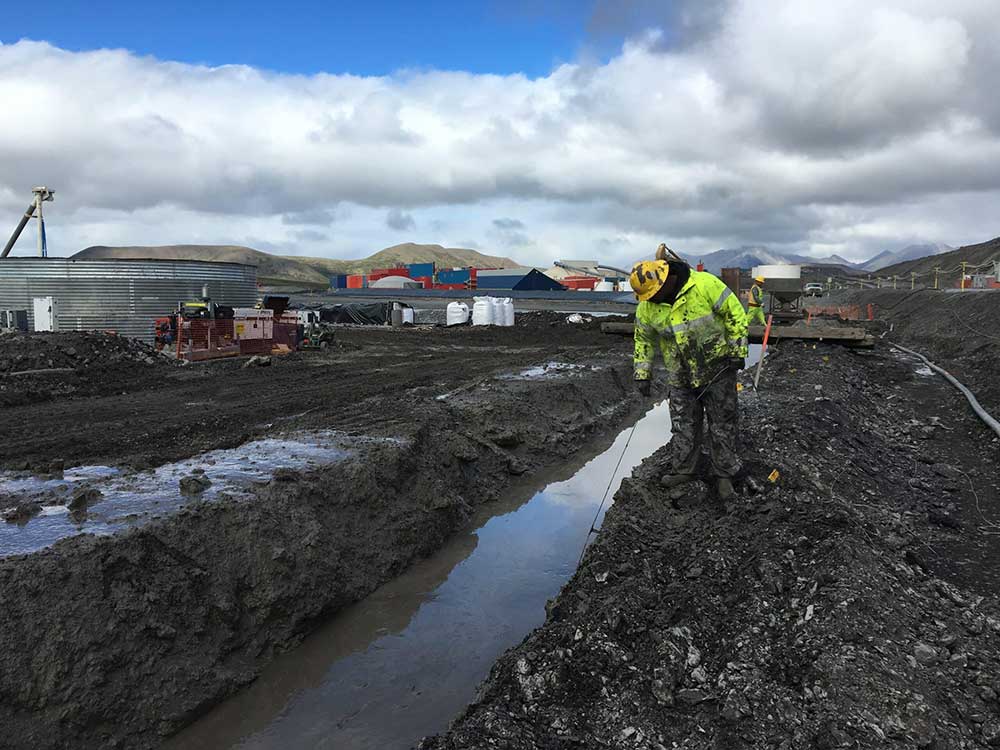 Slurry wall, excavating through permafrost and weathered shale